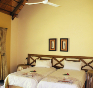 Photo of twin room with thatched roof at Vreugde Guest Farm